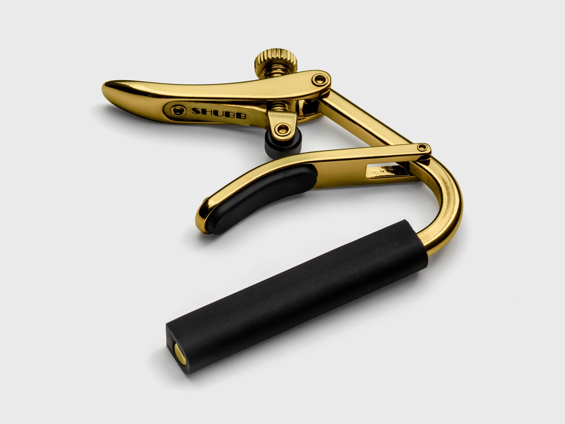 Capo Royale C2G pour guitares cordes nylon (touche plate), finition titane haute-qualité, doré